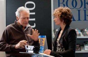 (L-r) Director CLINT EASTWOOD and CÉCILE de FRANCE on the set of Warner Bros. Pictures’ drama “HEREAFTER,” a Warner Bros. Pictures release.